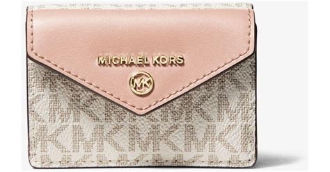 who did michael kors just buy